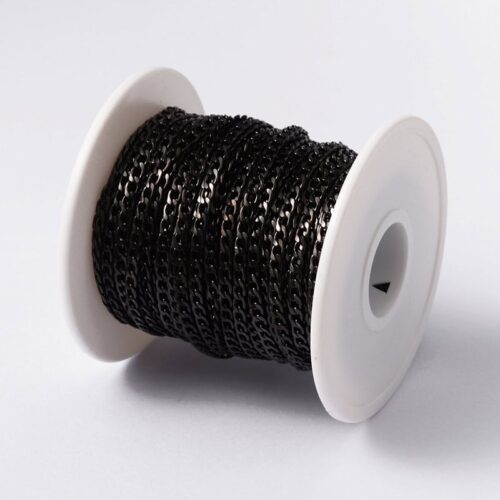 Black twisted metal jewellery chain figaro link pattern matte black finish draped over white bowl jewellery making Australia