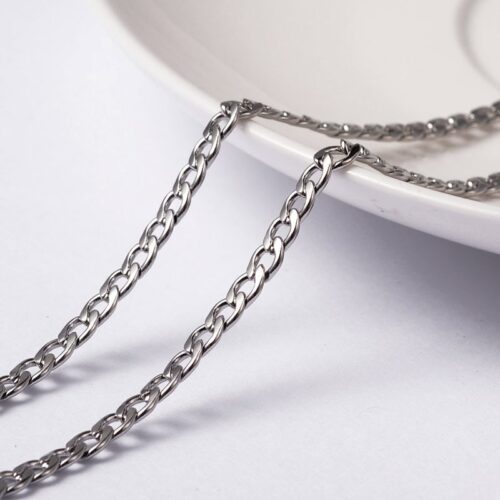 Stainless steel silver twisted chain uniform curb link mirror bright silver finish two lengths draped over white bowl jewellery making Australia