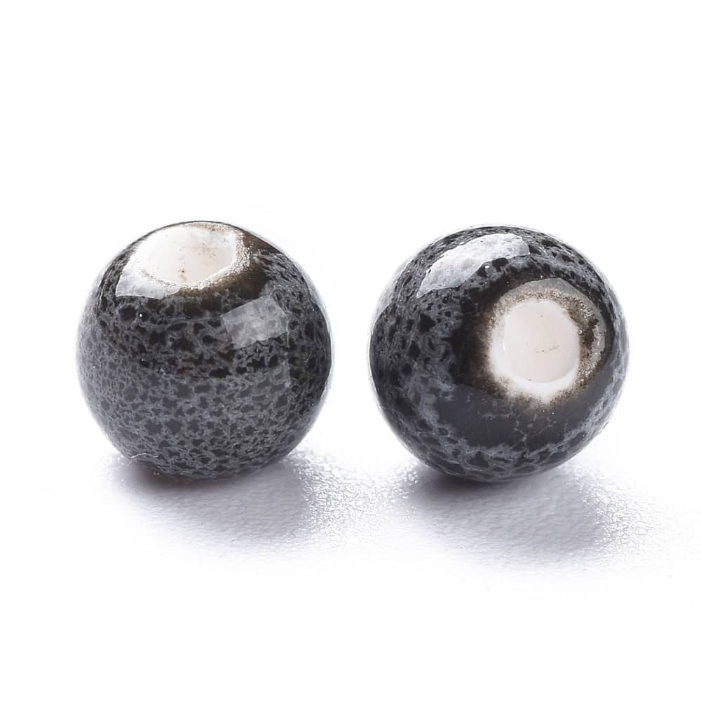 Porcelain round beads 6mm dark speckled black grey volcanic glaze finish white porcelain bead hole shown bulk close-up ruler and coin scale jewellery making Australia