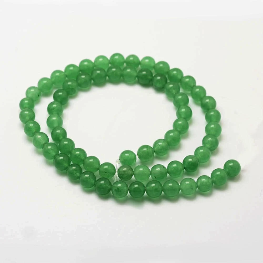 Green aventurine glass beads 8mm round on white background