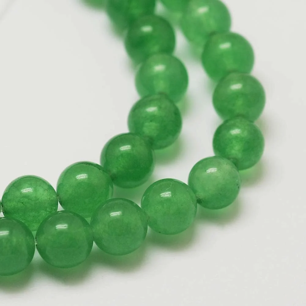 Green aventurine glass beads 8mm round on white background