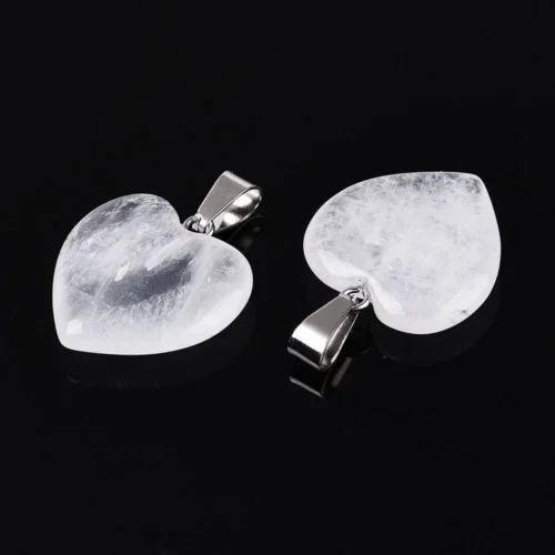 Natural crystal heart pendant clear quartz icy clarity with natural inclusions silver bail on black background