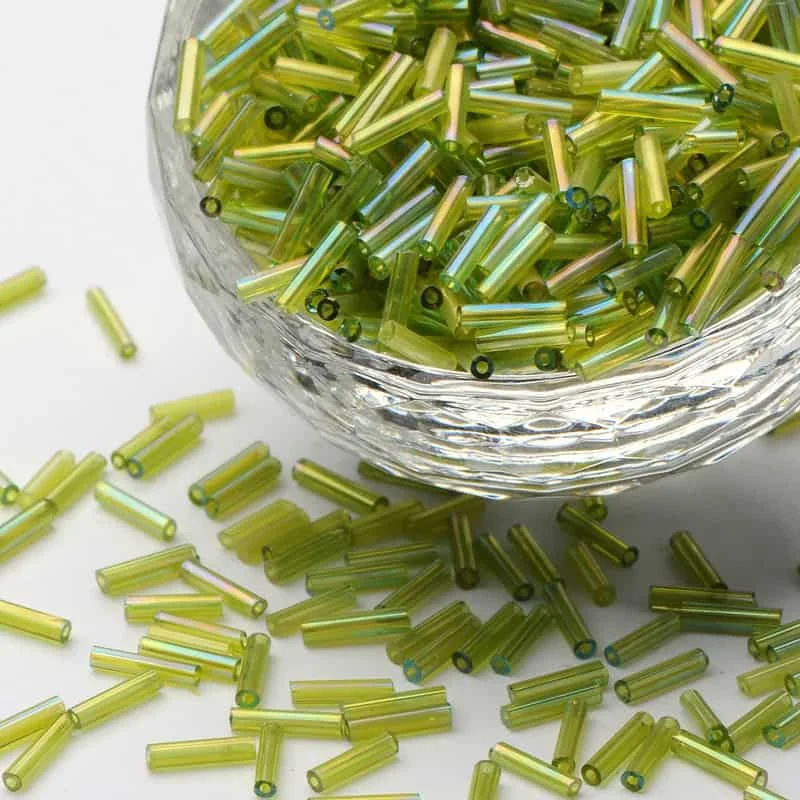 Green yellow bugle seed beads AB iridescent aurora borealis coating transparent chartreuse tube beads in glass bowl Australia