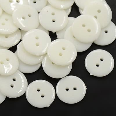 Acrylic 2 hole button for costume design off-white glossy domed round sewing buttons on dark background Australia