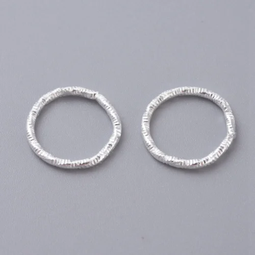 Silver Plated Twisted Closed Jump Rings — Chipped Faceted Texture