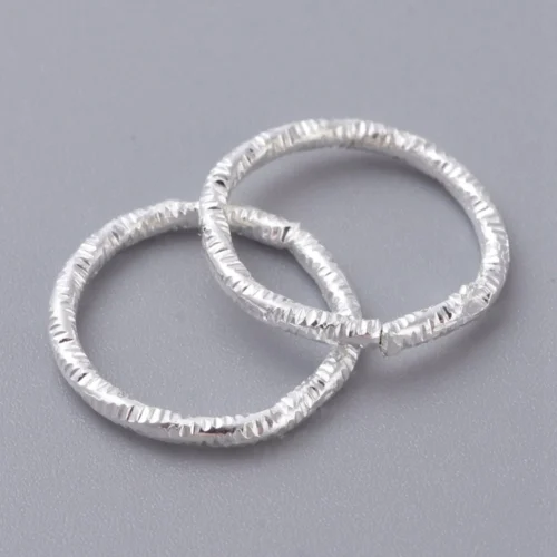 Silver Plated Twisted Closed Jump Rings — Chipped Faceted Texture