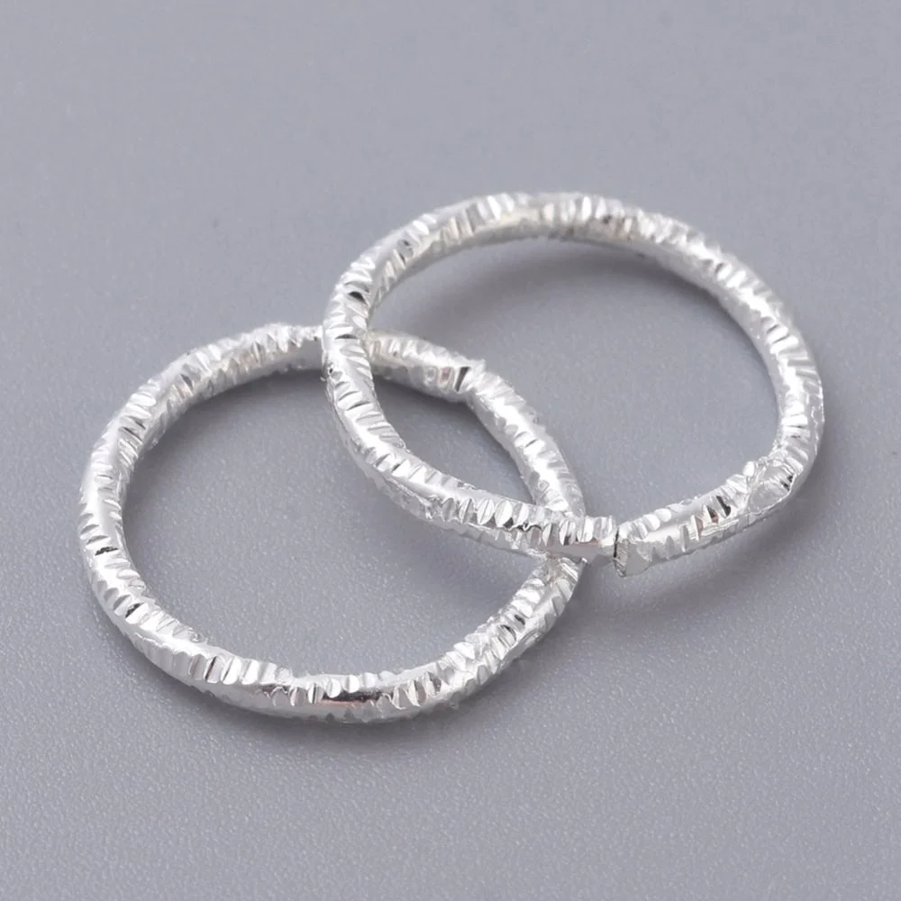 Silver Plated Twisted Closed Jump Rings — Chipped Faceted Texture